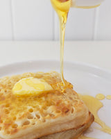 Syrup pouring over delicious gluten free free from Liberate Crumpets